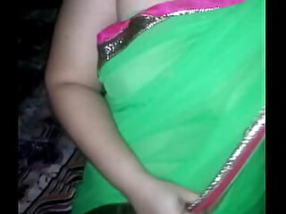 Shonali clad stifling to green sari